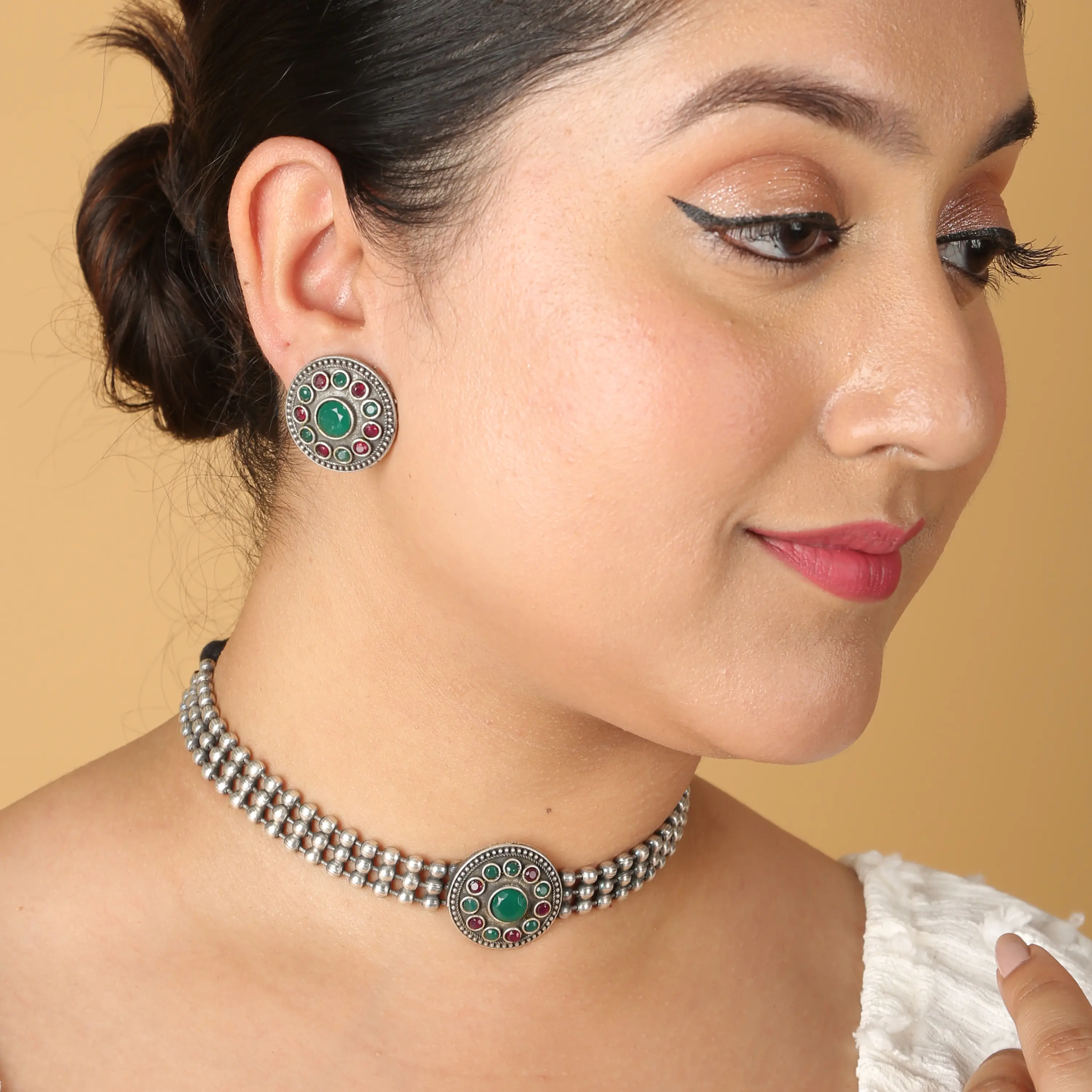 Oxidised silver choker with green stone styled on model — on-model jewellery photography
