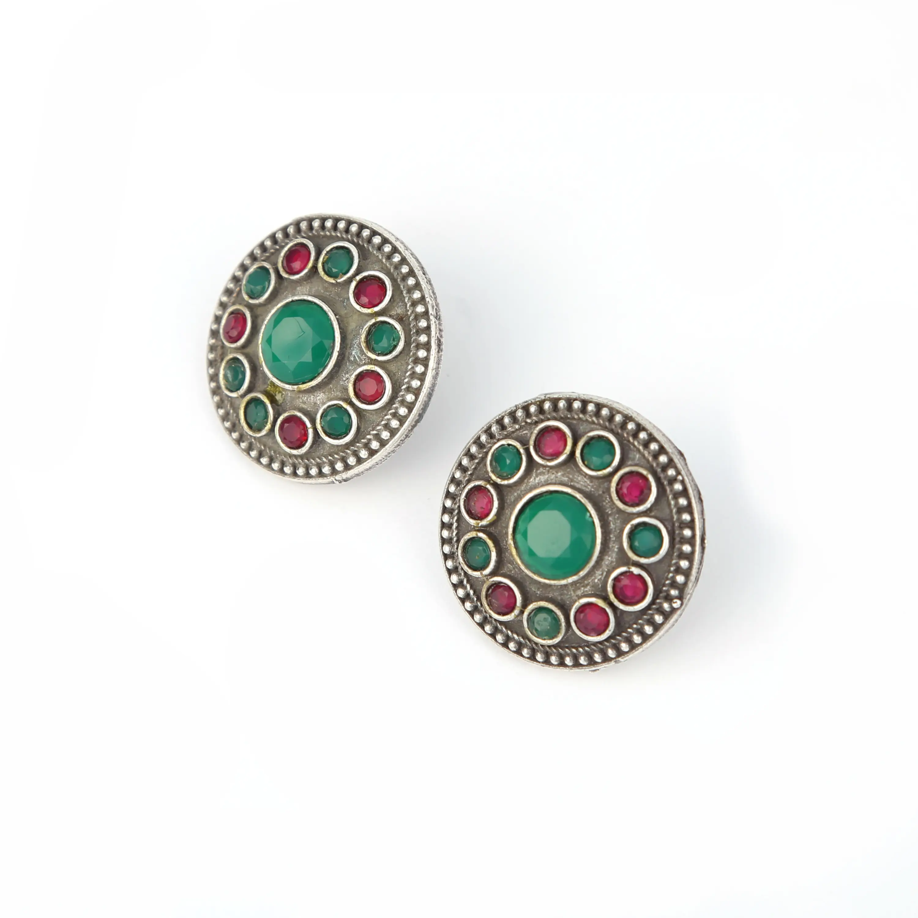Oxidised silver stud earrings with green and red stones — silver jewellery photography Udaipur