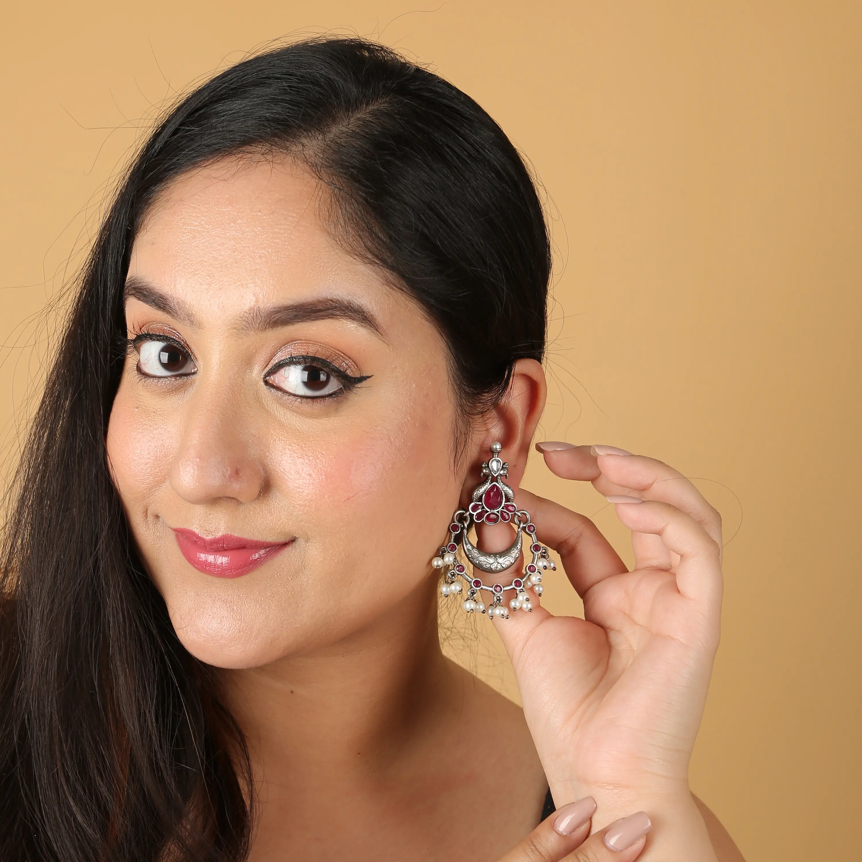 Model wearing oxidised silver jhumka earrings — on-model bridal jewellery photography Udaipur